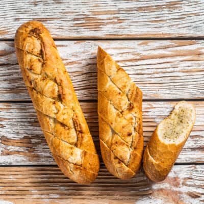 low carb garlic baguette on a wooden background