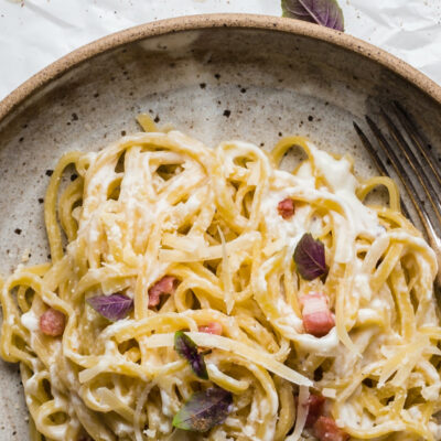 keto pasta carbonara on a plate with a fork on the right hand side