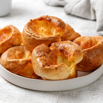 A white plate filled with 8 low-carb yorkshire puddings