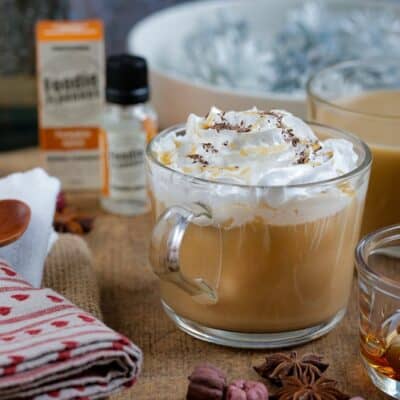 foodie flavour pumpkin spiced latte in glass mug with ingredients spread around